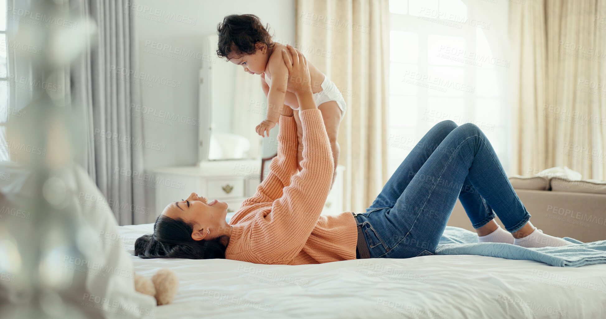 Buy stock photo Happy woman, mother and playing with baby in bedroom for fun, quality time or bond. People, family and smile on face in excitement for infant in home with love, care or trust in support for future