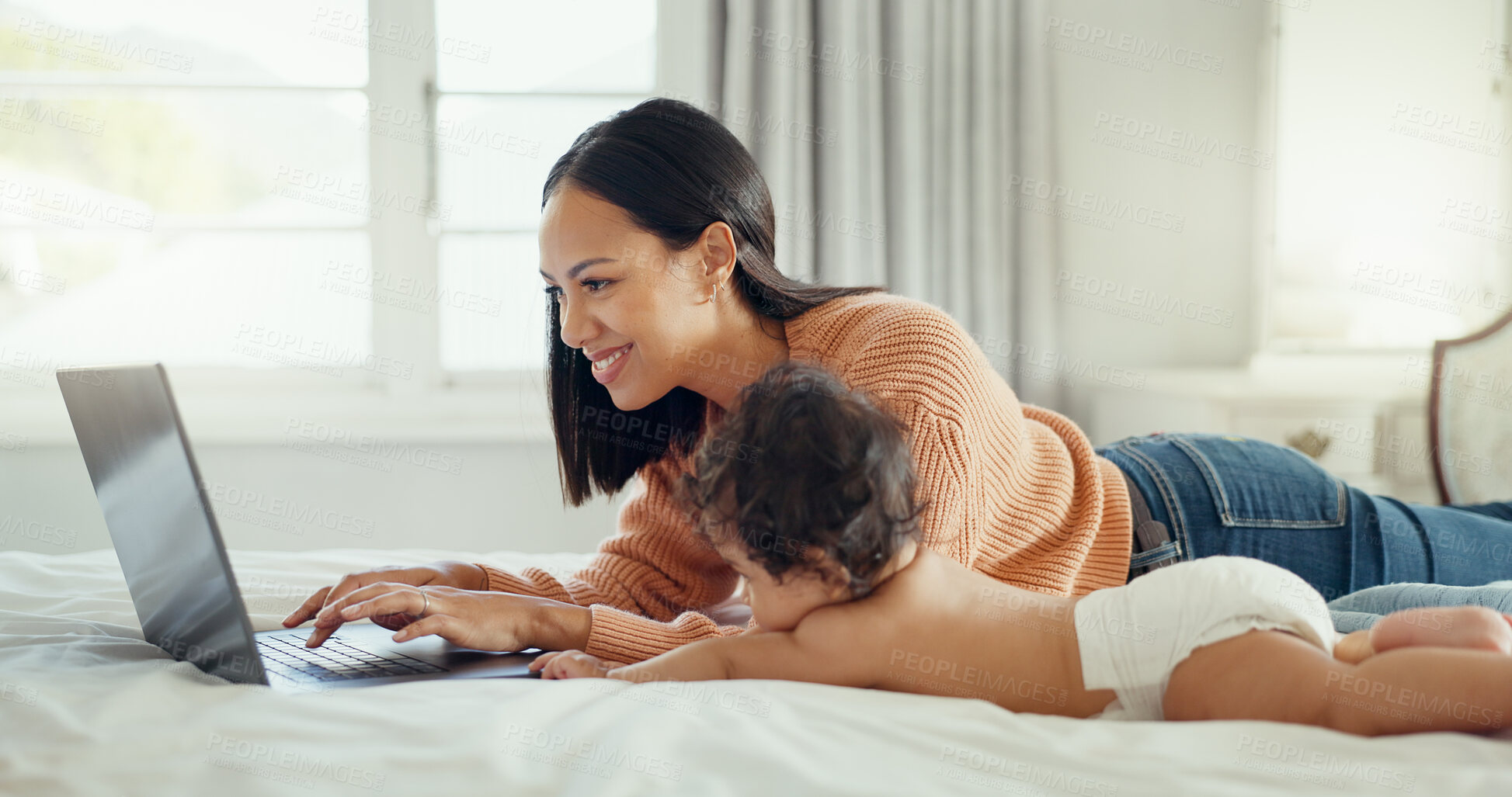 Buy stock photo Typing, laptop and mother working with baby on a bed for remote work and babysitting in a home bedroom. Happy, online and woman parent with infant while writing a blog on website or internet