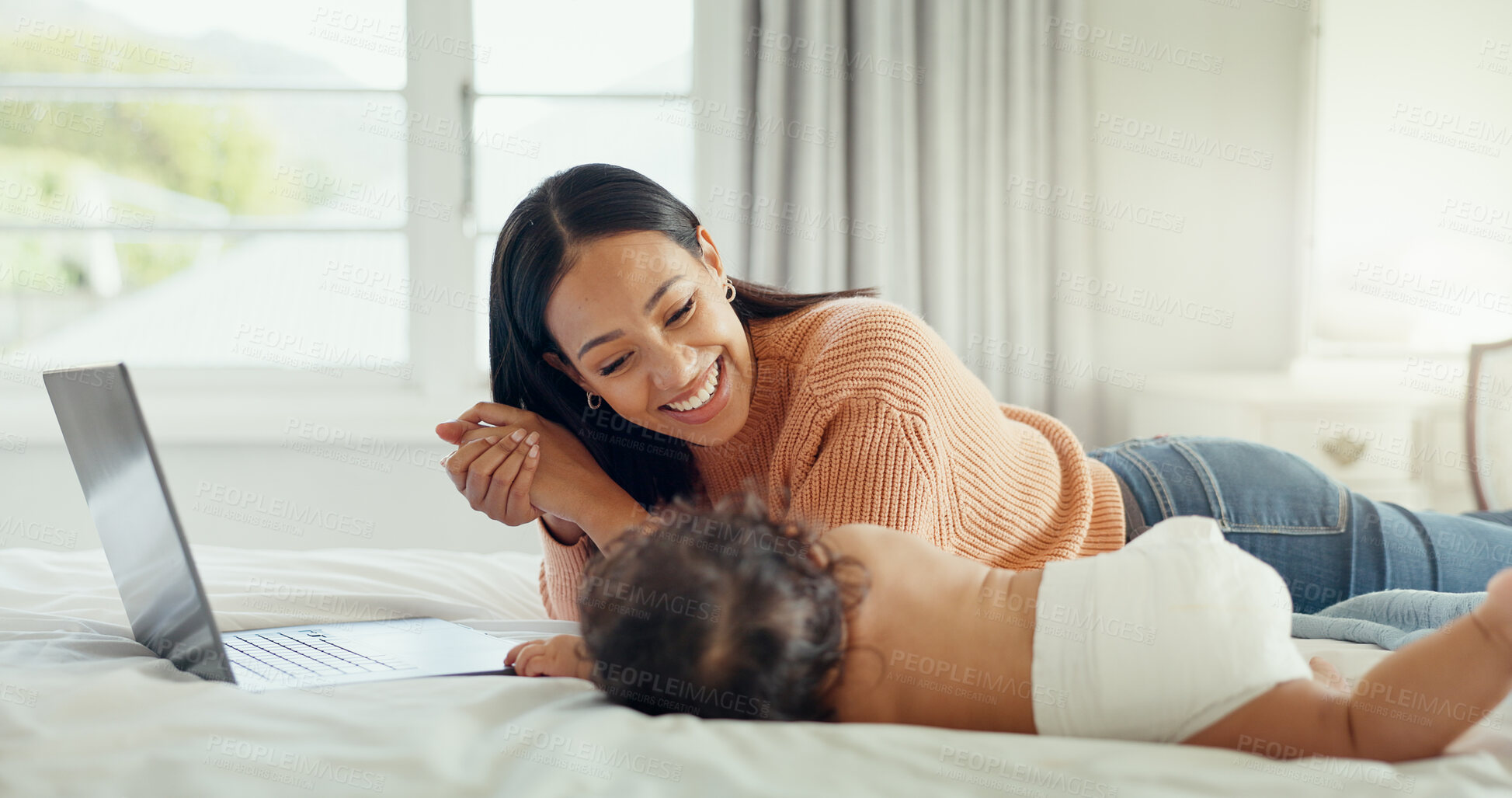 Buy stock photo Parent, laptop and mother playing with baby on a bed for remote work and babysitting in a home bedroom. Happy, online and mom typing with newborn or infant while writing a blog on website or internet