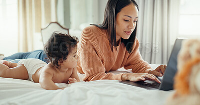 Love, laptop and mother with baby in a bed for bonding, relax and playing in their home. Family, social media and female mom influencer with newborn in a bedroom and content creation for online blog