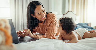 Love, laptop and mother with baby in a bed for bonding, relax and playing in their home. Family, social media and female mom influencer with newborn in a bedroom and content creation for online blog