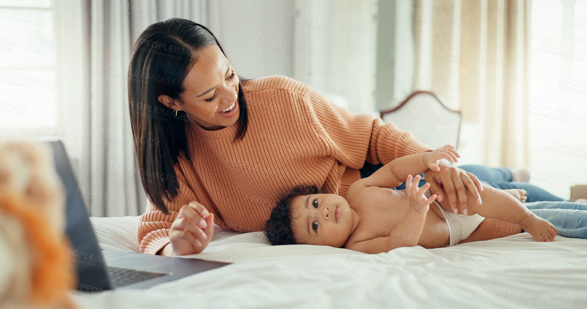 Buy stock photo Laptop, remote work and a mother on a bed with her baby in the home together for love, care or multitasking. Family, smile and woman as a freelance employee with her infant child in the bedroom