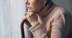 Thinking, window and hands of old woman and walking stick in bedroom for wellness, retirement and healthcare. Depression, mental health and nursing home with closeup of patient with a disability