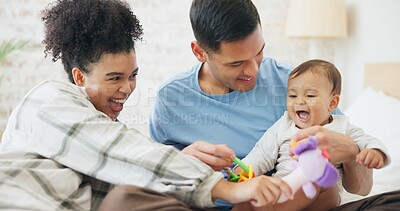 Family, couple and quality time with baby, mom and dad playing with toys for fun, laughing together in home, bedroom or nursery. Newborn, infant and happiness in motherhood, family or child smile