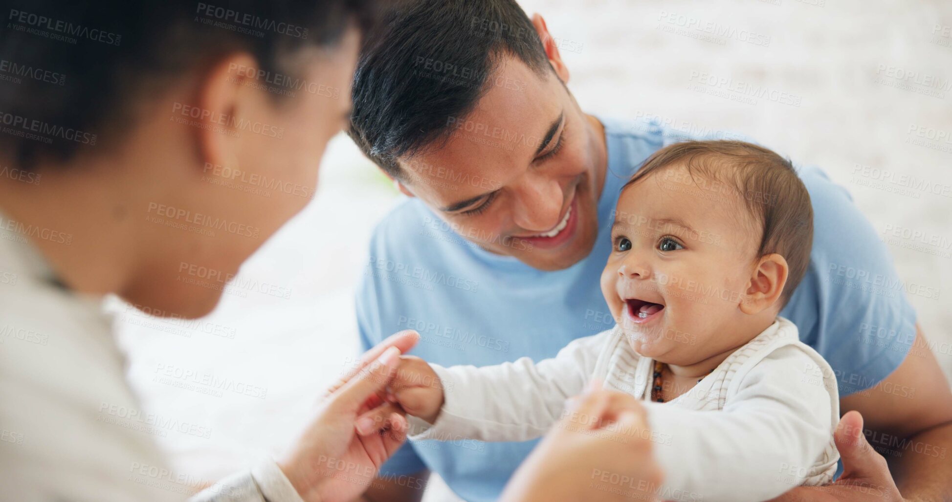 Buy stock photo Baby, playing and father with mom in bedroom with happiness with love or care on weekend. Happy, infant and playful with parents or dad for bonding at family home with funny expression or newborn.