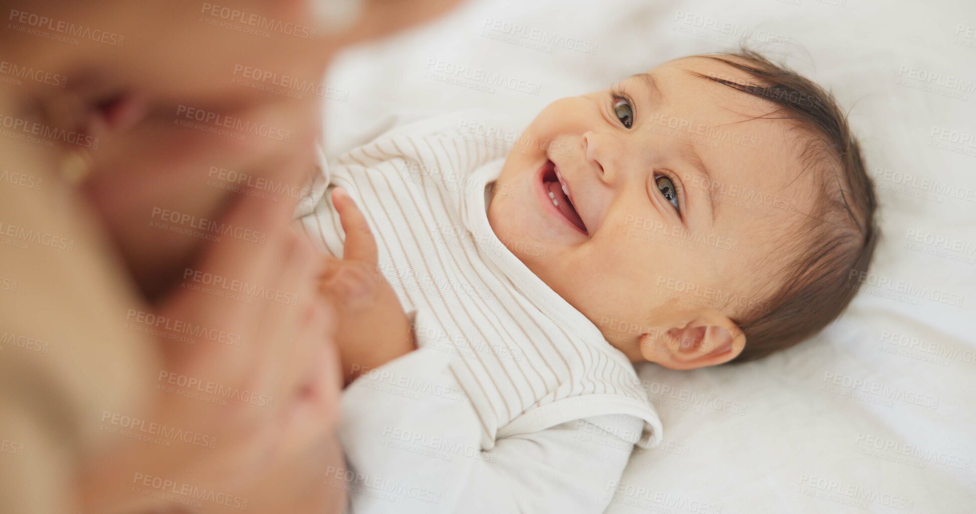 Buy stock photo Baby child, mother and peekaboo on bed with stretching legs, game and funny surprise in family house. Mama, young infant kid and playing together with wow, comic bonding and care with love in nursery