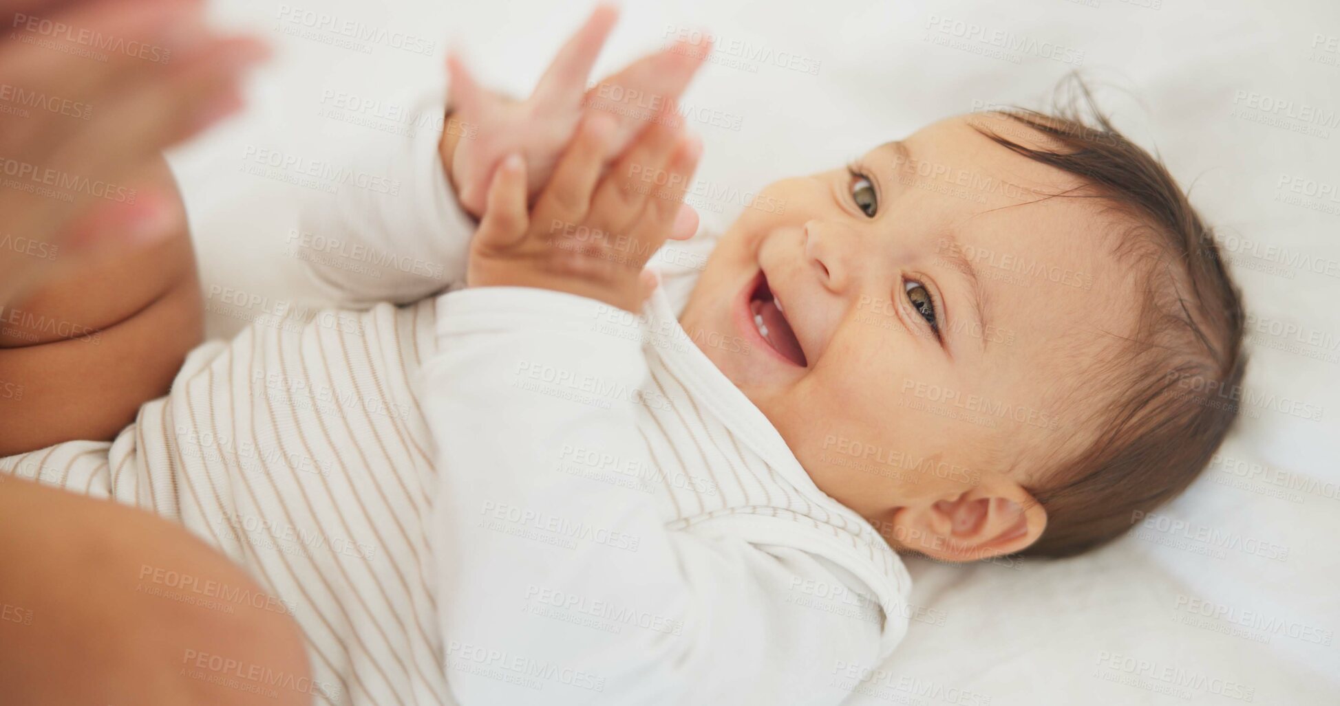 Buy stock photo Infant baby, clapping hands and bed with parent, care or learning with smile, love or childhood development. Young happy kid, nursery or bedroom with teaching, applause or excited face in family home