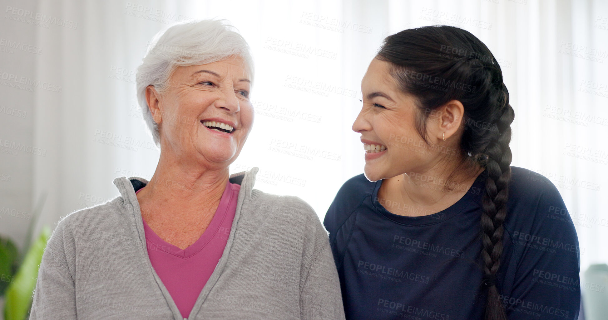 Buy stock photo Family, love and a woman with her senior mother in the home together for a retirement visit. Face, smile and an elderly parent with her happy young daughter in a house to relax while bonding