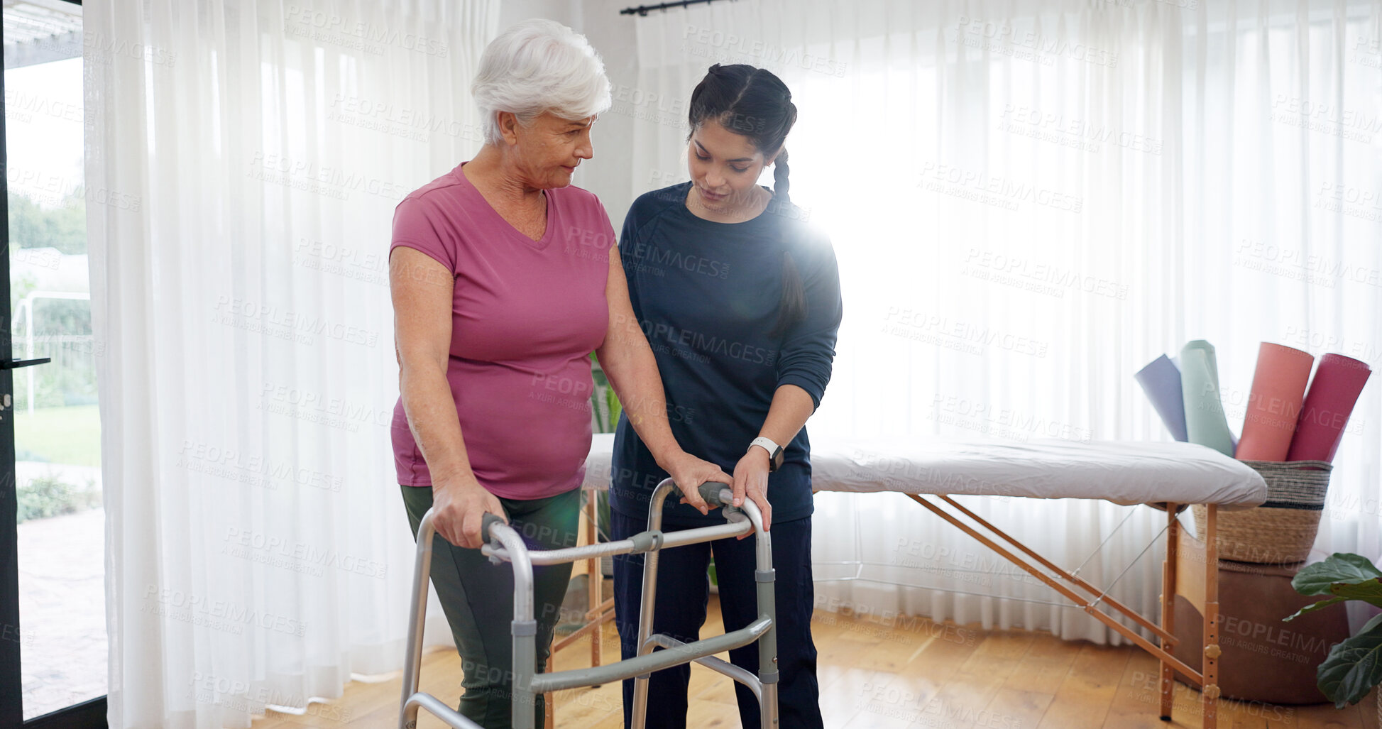 Buy stock photo Physiotherapy doctor, walker and senior woman with disability, healthcare rehabilitation or healing injury. Physiotherapist support patient with walking frame, balance assessment or mobility progress