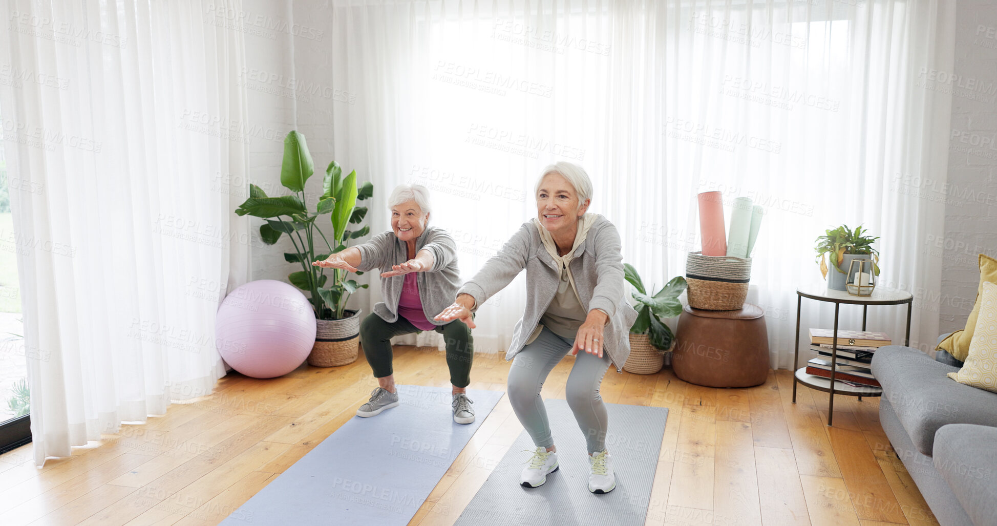 Buy stock photo Senior, women and squat exercise in home for fitness health, balance or wellness. Elderly people, smile or yoga mat for strong body or retirement joy workout, happiness or mobility training in lounge