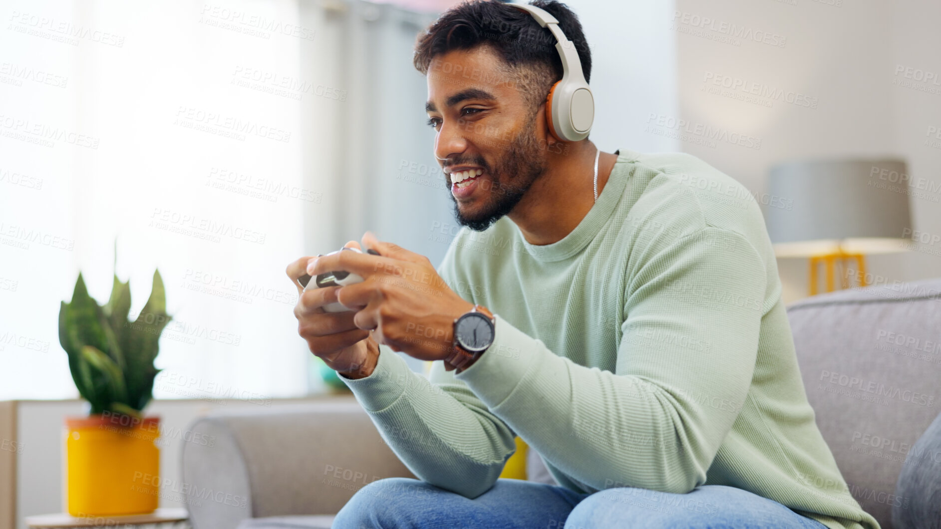 Buy stock photo Gaming, winner and esports with a man in the living room of his home, playing a video game for fun. Winning, celebration and next level with a gamer using a joystick controller to play console games