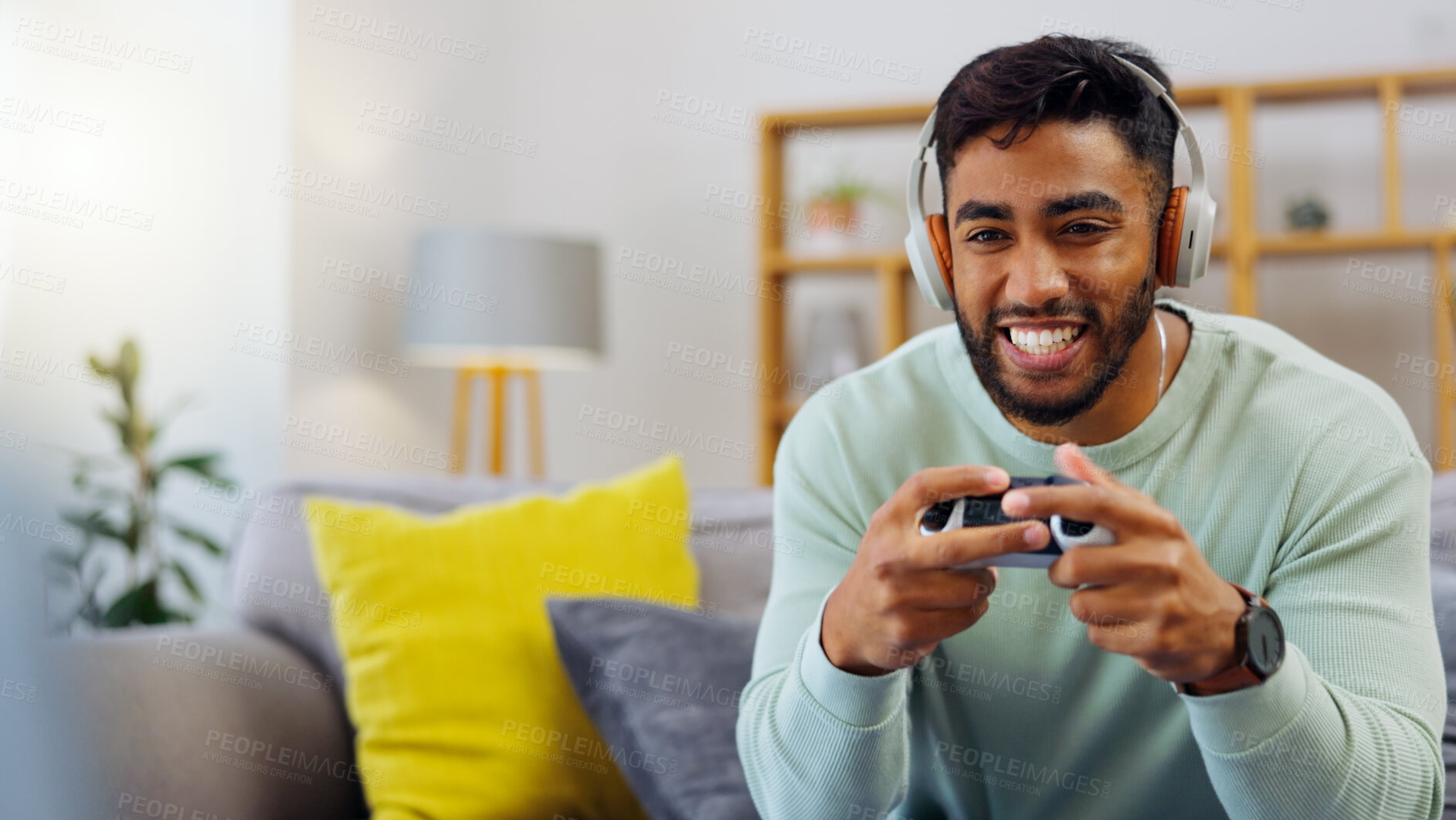 Buy stock photo Gaming, winner and esports with a man in the living room of his home, playing a video game for fun. Winning, celebration and next level with a gamer using a joystick controller to play console games