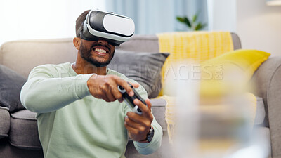 Vr, gaming Indian man in virtual reality in home on sofa in living room, laughing and having fun. 3d metaverse, esports gamer and happy young male playing futuristic games with controller