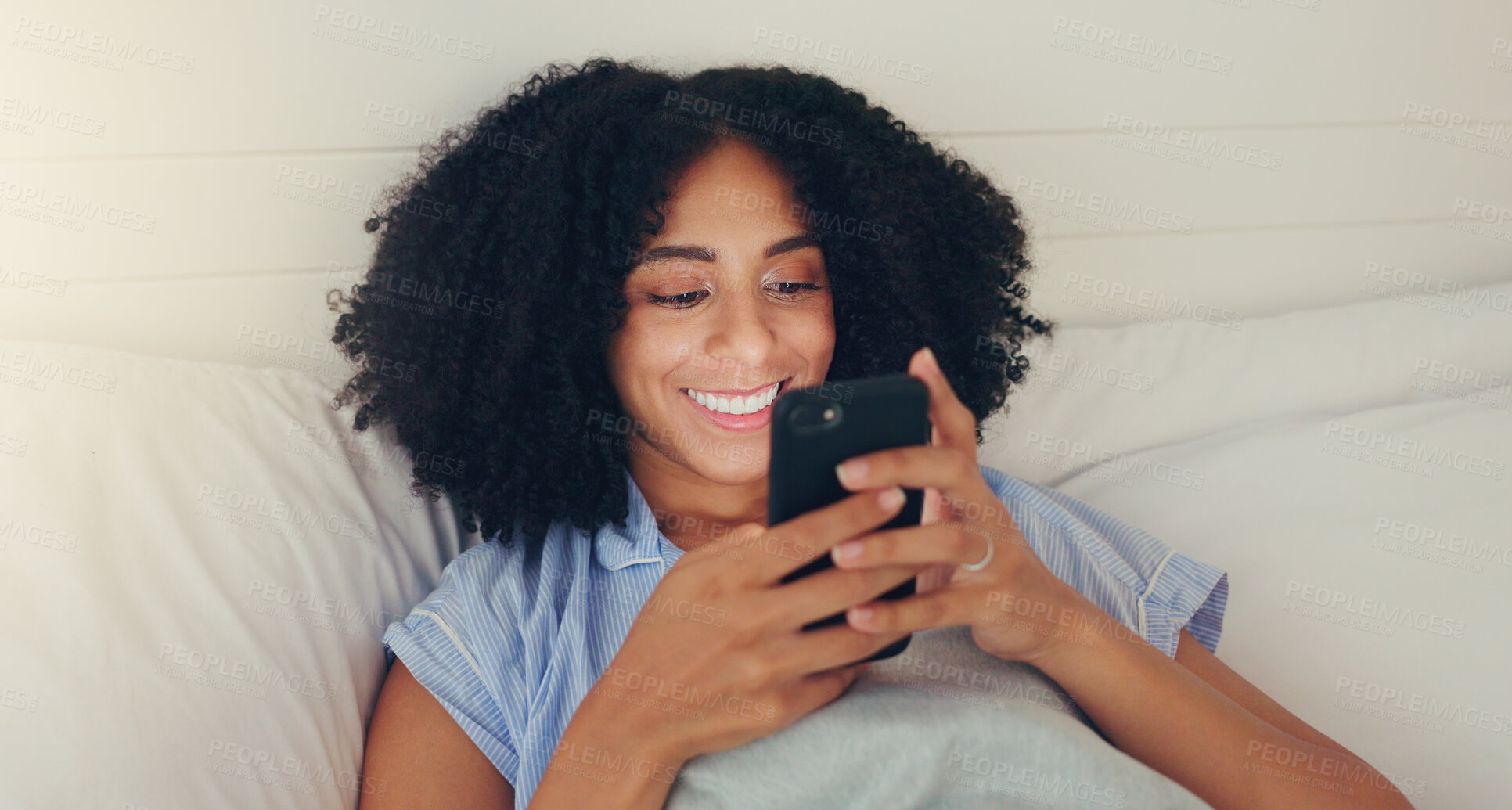 Buy stock photo Phone, happy woman and bed of a young female texting on a social media app in the morning. Wifi, web networking and happiness of a young person with a smile in a house writing a text in a chat