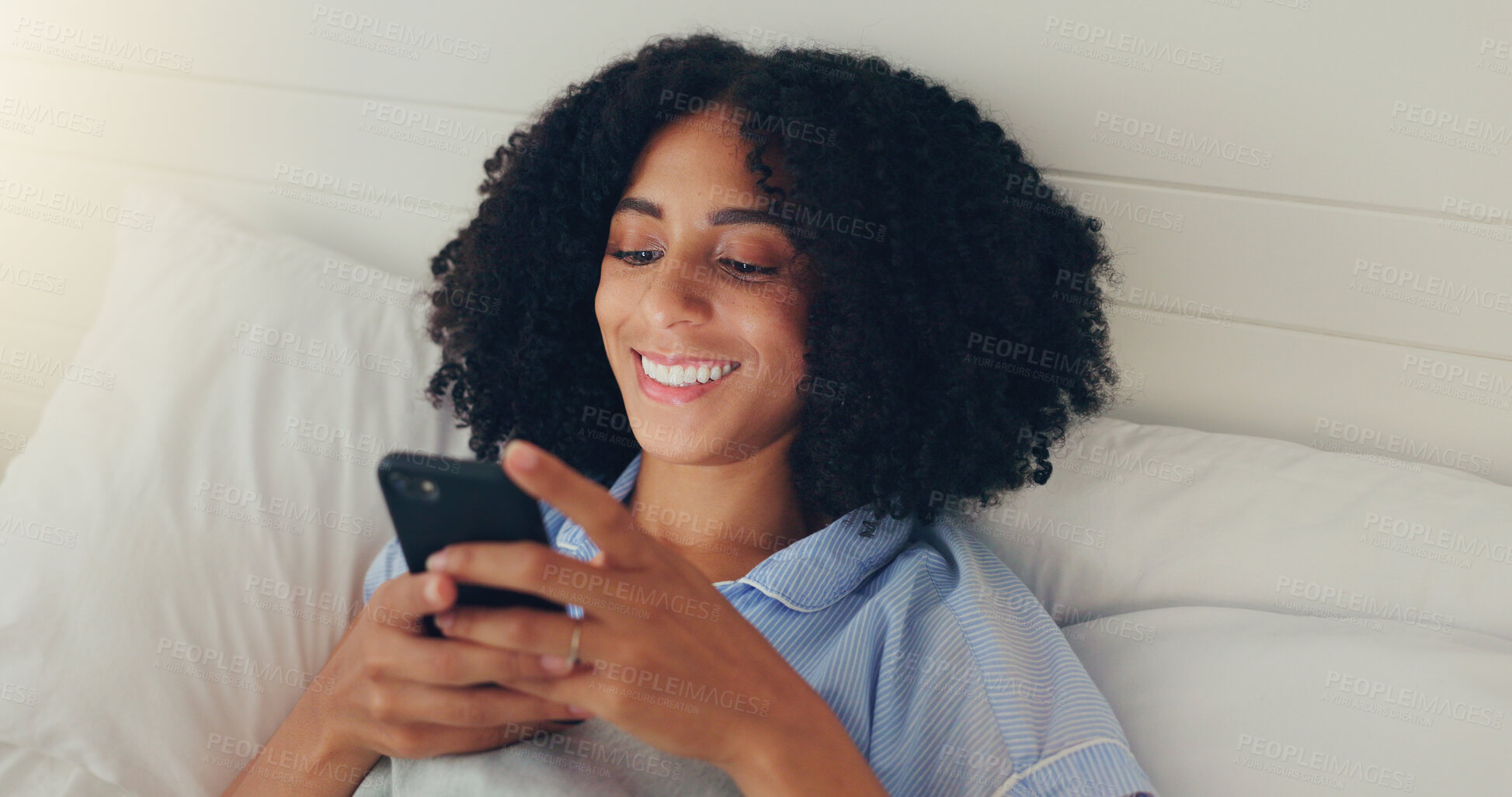 Buy stock photo Phone, happy woman and bed of a young female texting on a social media app in the morning. Wifi, web networking and happiness of a young person with a smile in a house writing a text in a chat