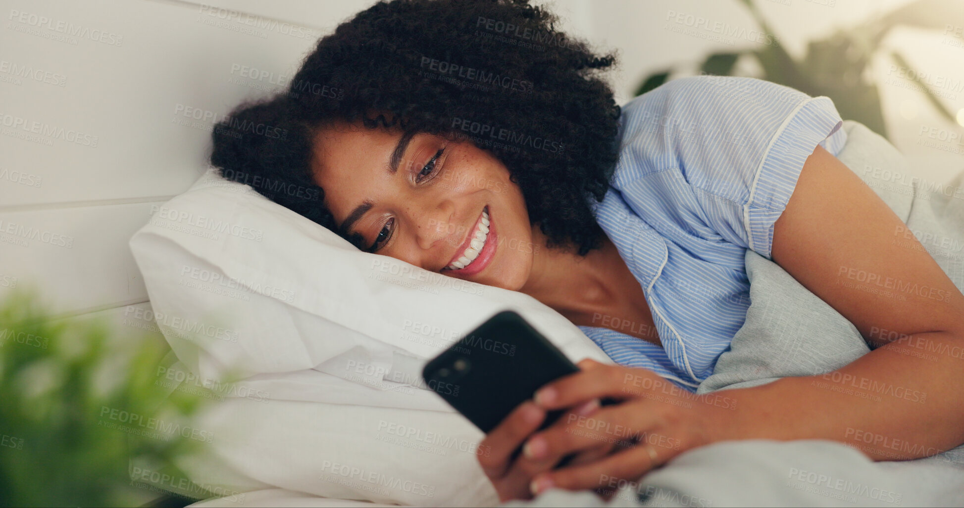 Buy stock photo Phone text, happy woman and bed of a young female texting on a social media app in the morning. Wifi, web networking and happiness of a young person with a smile in a house reading a message