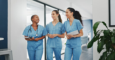 Buy stock photo Happy nurses, talking or walking in hospital in teamwork, nurse collaboration with documents. Doctors, women or healthcare workers laugh in communication or discussion for medicine treatment on break