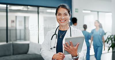 Buy stock photo Woman, doctor and busy hospital, tablet and healthcare services, leadership and career mindset. Portrait, medical and professional with confidence, person and health app for clinic, insurance or job 