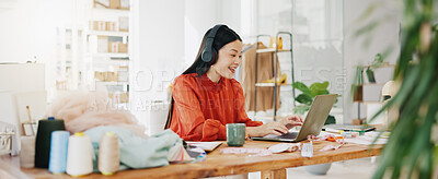 Video call, laptop and ecommerce with asian woman and headphones in warehouse for networking, fashion and design. Online shopping, meeting and conference with girl for clothes, startup and retail