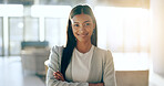 Portrait, happy business woman and arms crossed for legal advice in office with confidence, pride and trust. Manager, professional female lawyer at law firm or young attorney with smile at workplace.