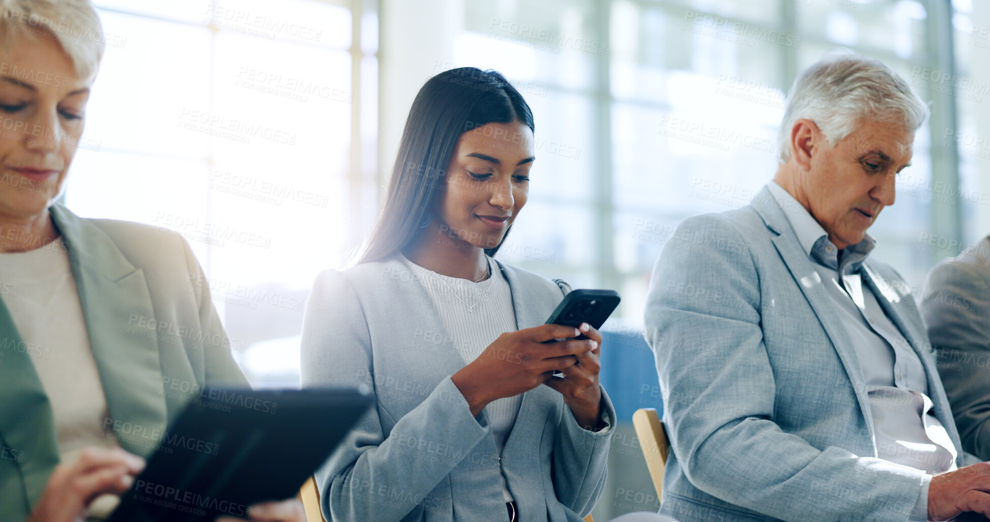 Buy stock photo Business people, phone and tablet in queue for interview, recruitment or research for opportunity. Women, man and reading on technology, preparation or waiting room for hiring, human resources or job