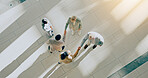 Above, handshake and group of business people welcome together and meeting in corridor for partnership or collaboration. Professional, deal and corporate team of employees in an office shaking hands