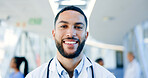 Man, face and doctor smile in hospital for healthcare services, surgery and consulting in Saudi Arabia. Portrait of happy surgeon, therapist and medical professional working with trust in busy clinic