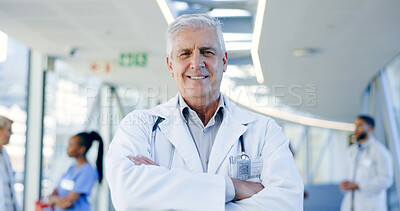 Doctor pride, face and a man with arms crossed for healthcare, emergency service or nursing. Happy, hospital and portrait of a mature surgeon or clinic worker with confidence in medical career