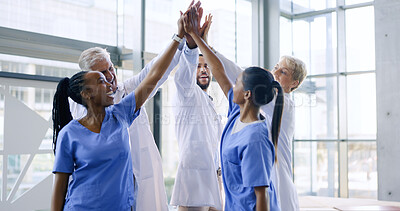High five, nurses or doctors with medical success in celebration of results in hospital with teamwork. Bonus, surgeon or happy healthcare workers celebrate targets, bonus or winning goals in meeting