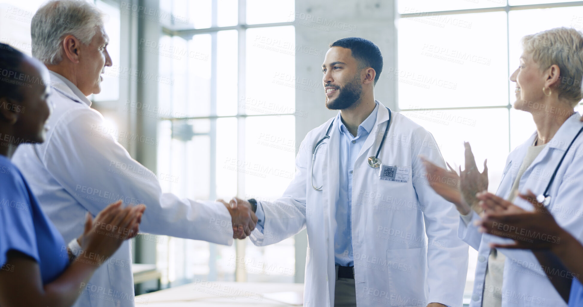 Buy stock photo Healthcare, applause and handshake by doctors in a hospital with partnership, success or deal. Thank you, shaking hands and medical team excited for clinic promotion, congratulations or achievement