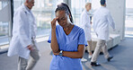 Headache, nurse and black woman with stress in hospital for burnout, overworked and fatigue. Healthcare, busy medical clinic and health worker with injury, strain and migraine for anxiety or crisis