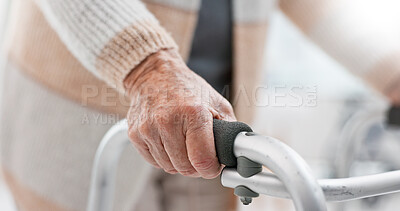 Hands, walker and an old person with a disability in recover or rehabilitation in a clinic for mobility and stability. Healthcare, medical and physiotherapy with a senior patient in a nursing home