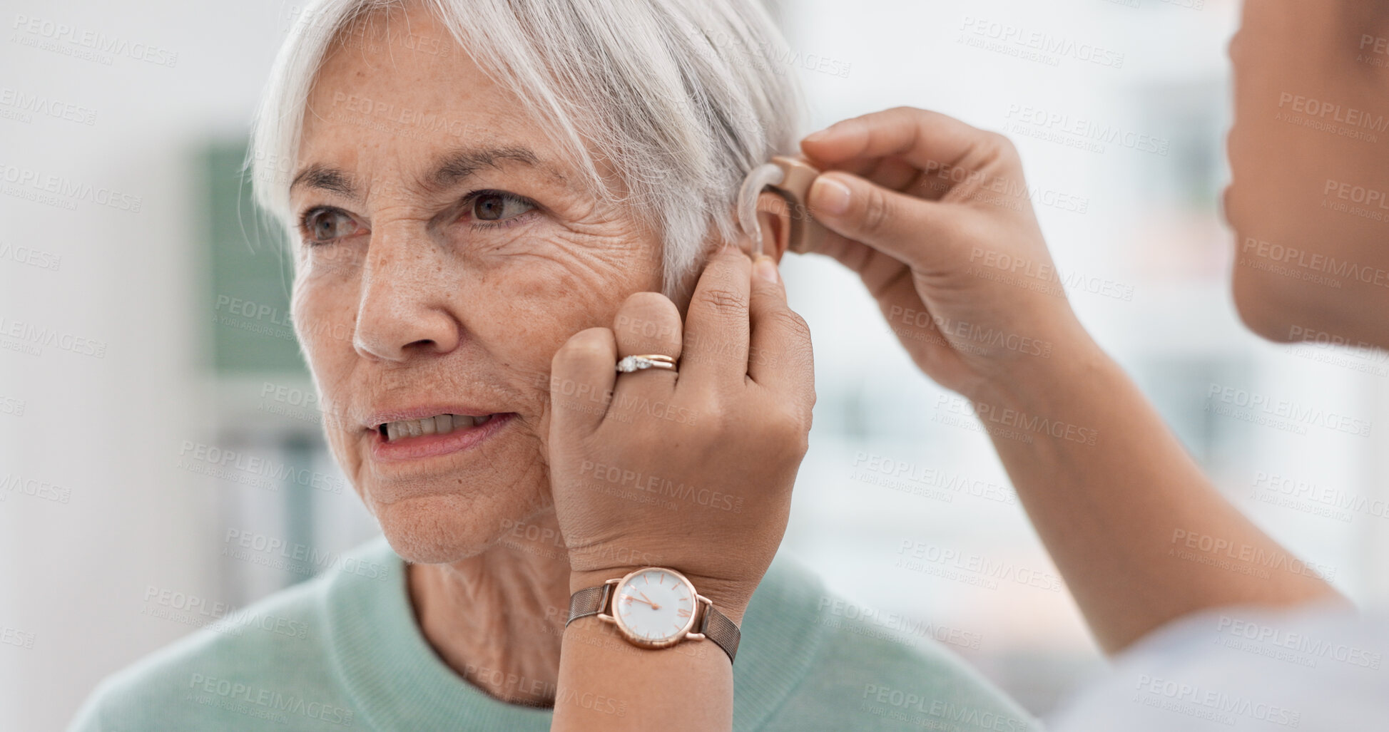 Buy stock photo Old woman, doctor hands and patient with hearing aid, help and support with healthcare in clinic. Person with disability, deaf and people, trust and communication, health insurance and medical