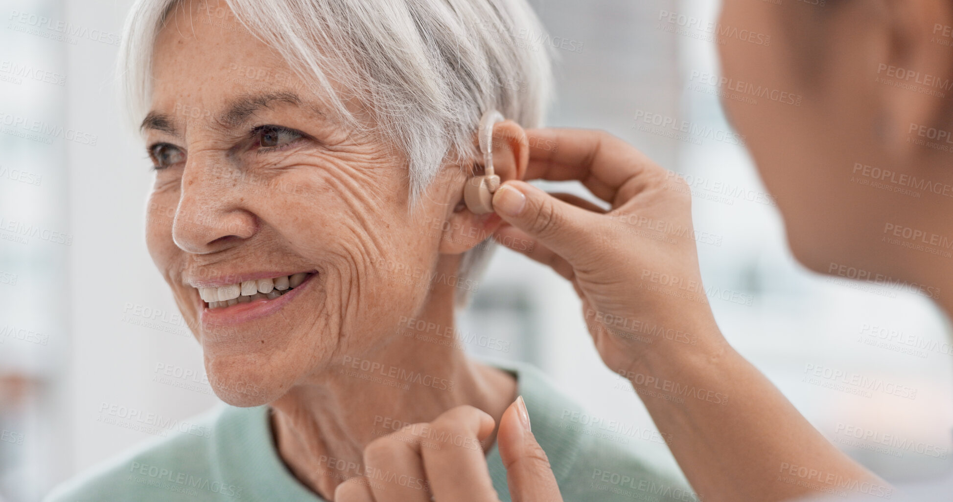 Buy stock photo Old woman, doctor hands and patient with hearing aid, help and support with healthcare in clinic. Person with disability, deaf and people, trust and communication, health insurance and medical
