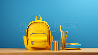 Backpack, books, and pencils on table on blue copyspace background