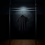 Black t-shirt mockup with copyspace on dark background on hanger, front view