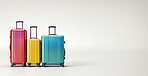 Suitcases on wheels on white copyspace background. Travel, vacation trip, visit to relatives concept