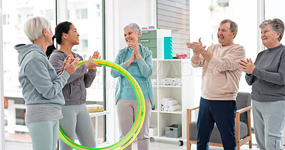 Fitness, senior and people with celebration at gym at end or exercise class for wellness. Elderly, group and friends in studio to congratulation after workout in retirement with coach and hula hoop.