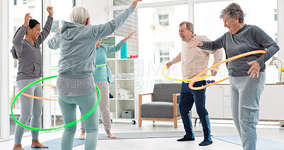 Fitness, senior and people with hula hoop at the gym for training, workout and health in retirement. Happy, together and a group of elderly friends with a coach and gear for an exercise class