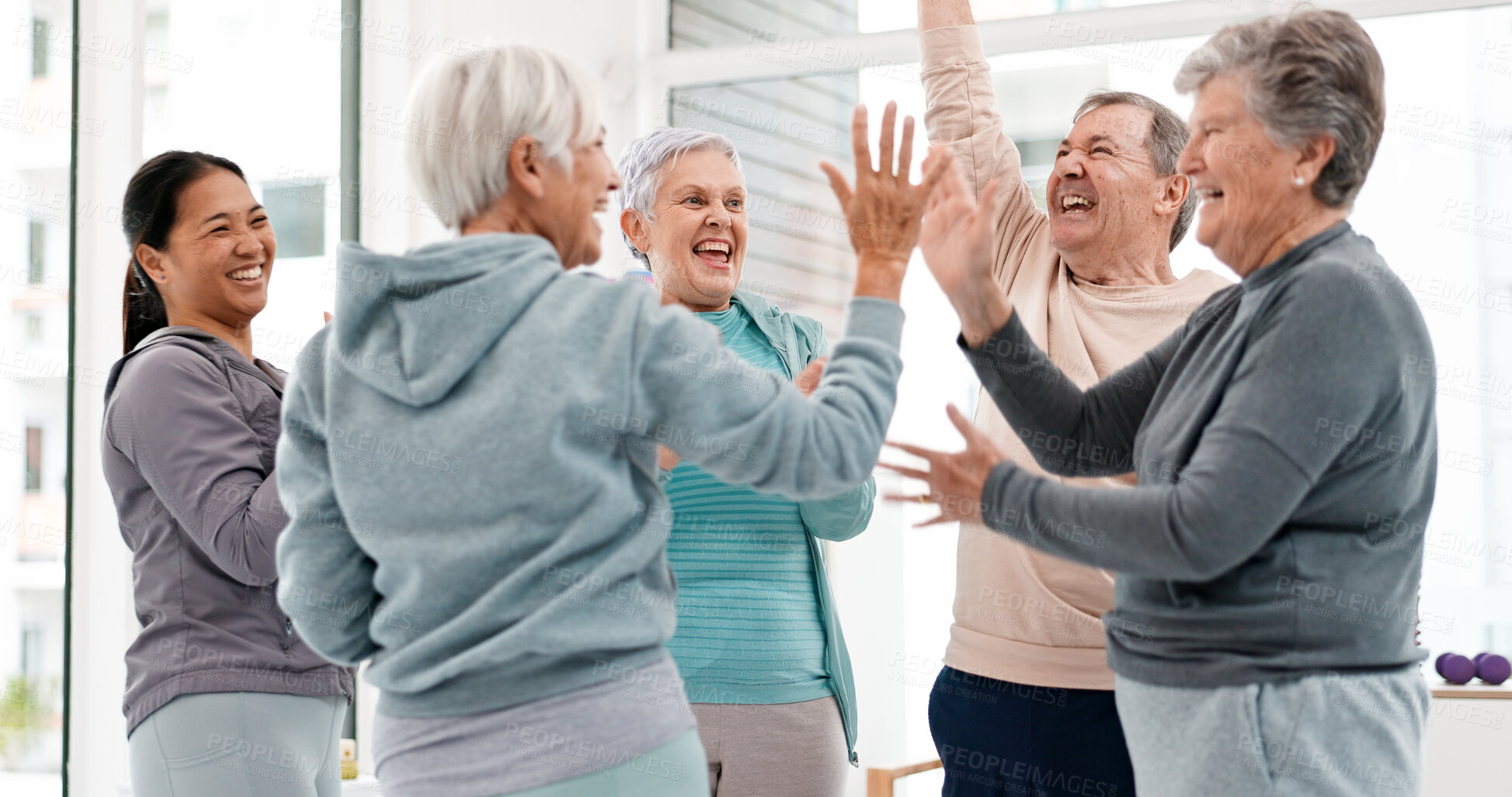 Buy stock photo Fitness, hands together and senior people for exercise support, celebration and teamwork in workout class. Exercise, training goal and group of elderly man and women with high five for health success