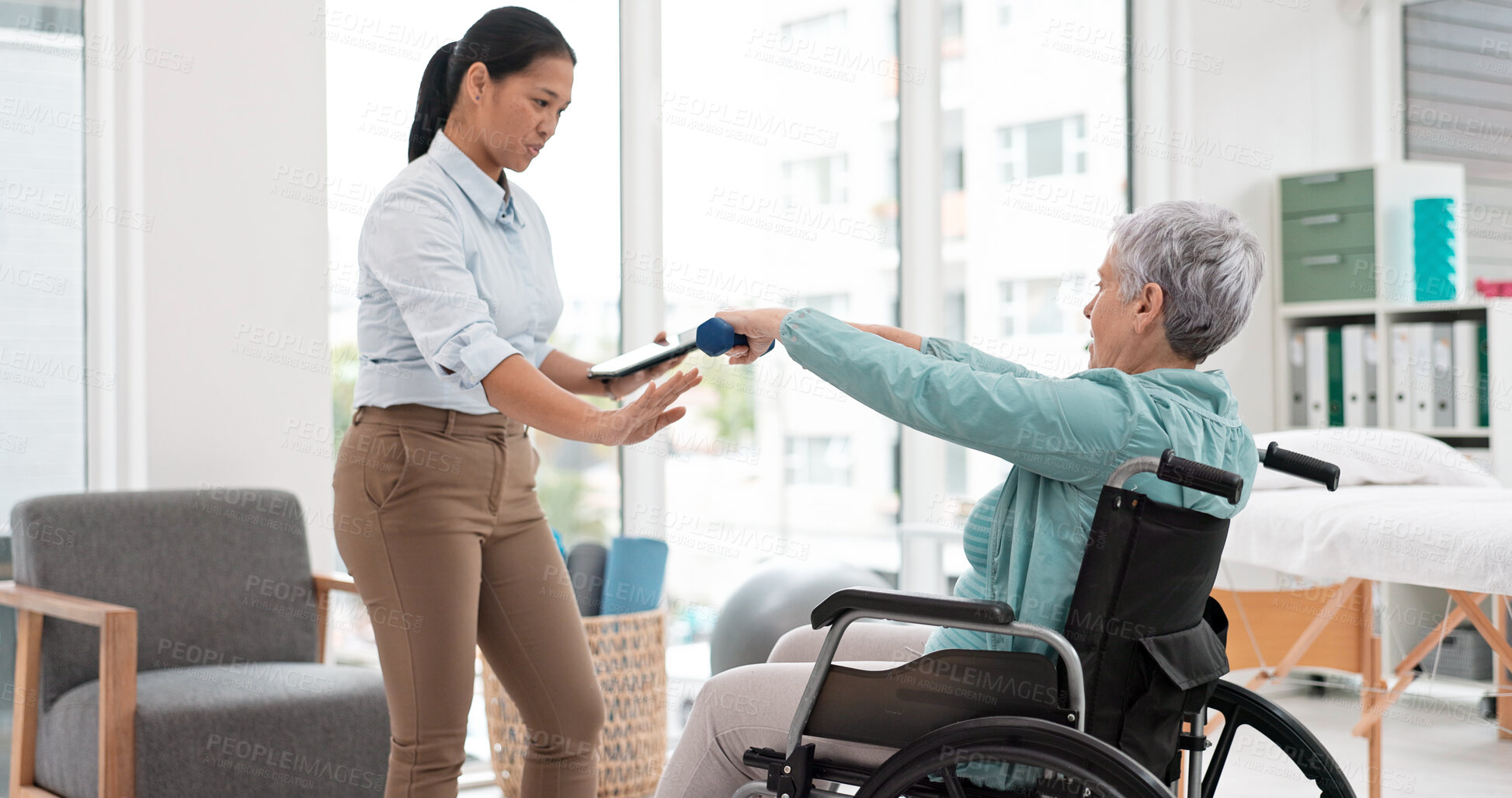 Buy stock photo Woman with disability, physiotherapy and dumbbell exercise for healthcare assessment, test or digital checklist of medical progress. Physiotherapist, tablet or consulting senior patient in wheelchair