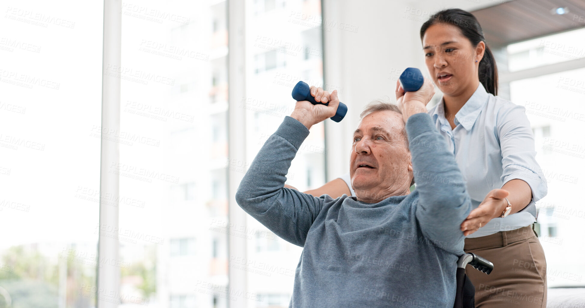 Buy stock photo Man with disability, physiotherapy and dumbbell exercise for healthcare rehabilitation, consulting and physical therapy assessment. Clinic, physiotherapist and support of senior patient in wheelchair