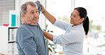 Old man, patient and physiotherapy of arm, medical rehabilitation or consulting doctor. Woman, physiotherapist and stretching for assessment of shoulder pain, arthritis or healthcare advice in clinic