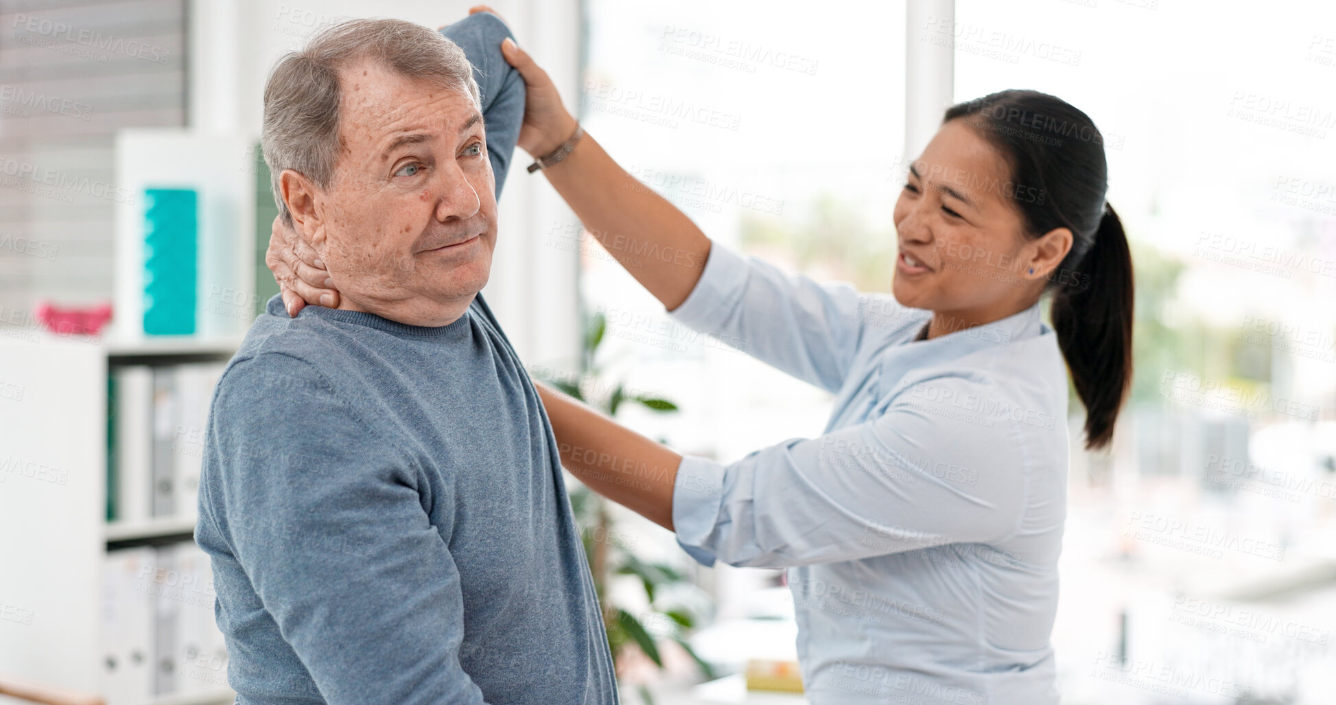 Buy stock photo Old man, patient and physiotherapy of arm, medical rehabilitation or consulting doctor. Woman, physiotherapist and stretching for assessment of shoulder pain, arthritis or healthcare advice in clinic