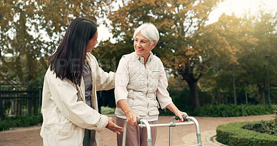 Park, walker and woman help senior walking as support, trust and care for morning healthcare exercise or workout. Health, physical therapy and elderly with caregiver for outdoor rehabilitation