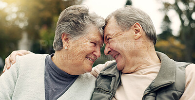 Forehead, touch and senior couple in a park with love, happy and conversation with romantic bonding. Fun, old people and elderly man embrace woman with care, romance or soulmate connection outdoor