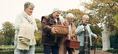 Buy stock photo Walking, picnic and senior friends in the park together for bonding or conversation during retirement. Smile, basket and a group of happy elderly people in a garden for freedom, fresh air to relax