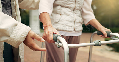 Buy stock photo Hands, support and senior person with a walker for injury rehabilitation, walking help and physiotherapy. Healthcare, patient with a disability and gear for nursing in retirement with a caregiver