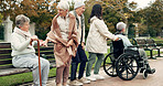 Friends, retirement and senior people in park for bonding, conversation and quality time together outdoors. Friendship, happy and elderly man and women with caregiver on bench for relaxing in nature