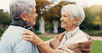 Buy stock photo Love, care and senior women embracing for affection, romance and bonding on an outdoor date. Nature, commitment and elderly female couple in retirement hugging in a green garden or park together.